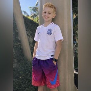 Boys size L Swim Trunks with Blue Nike Logo